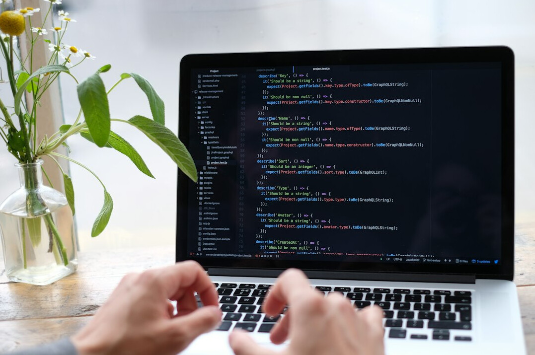 person learning programming on laptop